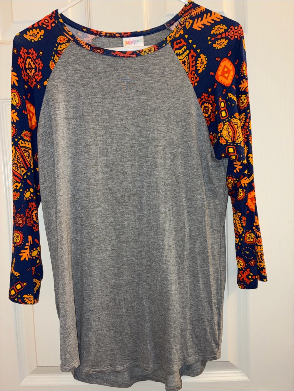 LuLaRoe Grey Tunic shirt with Navy and Orange Printed Sleeves